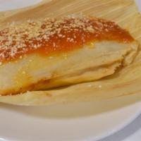Tamales · Choice of chicken or pork topped with ranchero salsa and grated cheese.