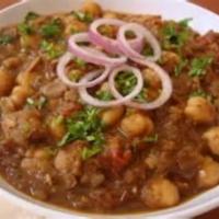32. Karahi Chana · Chick peas cooked in a special blend of fresh herbs and cumin seeds, garnished with green co...
