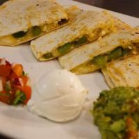 Vegetarianos Quesadilla · Flour tortilla with Jack cheddar cheese or Monterrey cheese and your choose of meat. Served ...