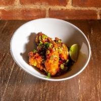Asian Style Strivers Wings · Gochujang, lemongrass, soy sauce, garlic, ginger, agave, scallions, and lime wedges.