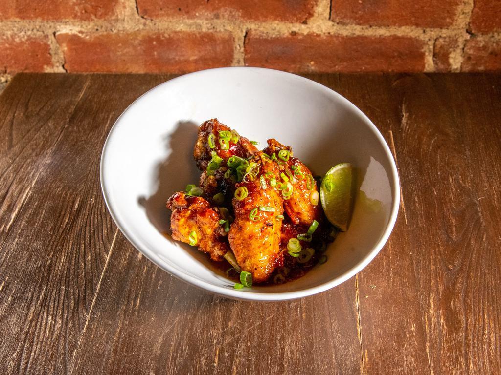 Asian Style Strivers Wings · Gochujang, lemongrass, soy sauce, garlic, ginger, agave, scallions, and lime wedges.