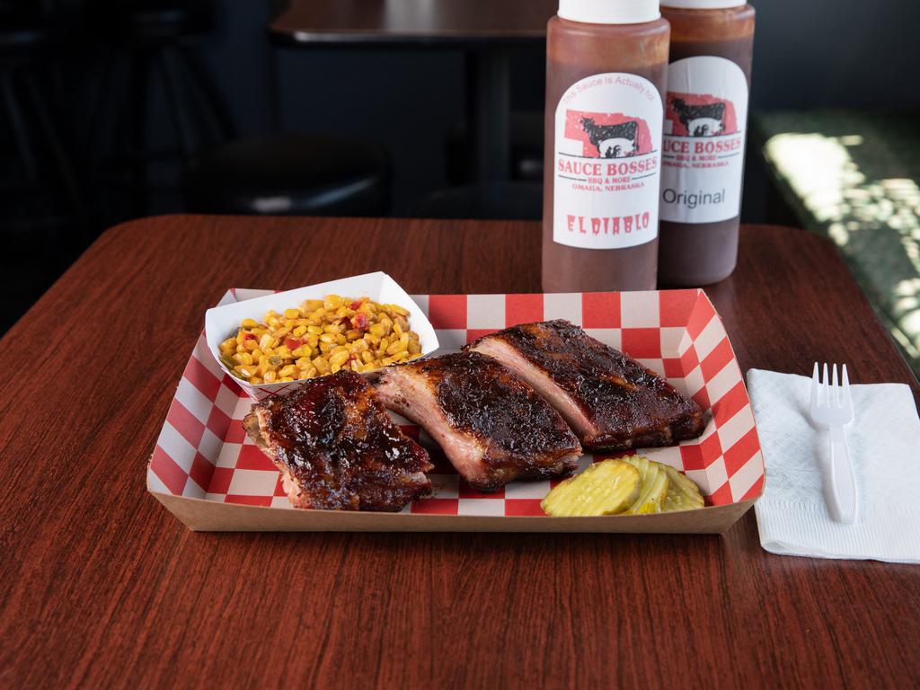 1/2 Rack St. Louis Ribs · 6 bones of ribs slow cooked over a wood fire.  These ribs are kissed with just a glaze of sauce.  