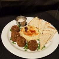 Falafel Hummus Platter · Served with tahini and pita bread.