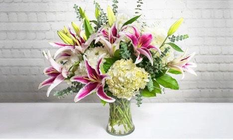 Love Struck · You're not just falling in love, you are absolutely head-over-heals love struck! Don't hold back-shout it from the rooftops and share your absolute infatuation with this dramatic bouquet of hydrangea, lilies, and eucalyptus.