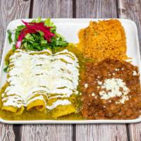 Chicken Enchiladas  · Mole chocolate sauce (contains nuts) or verde sauce, rice, beans, sour cream, cheese.