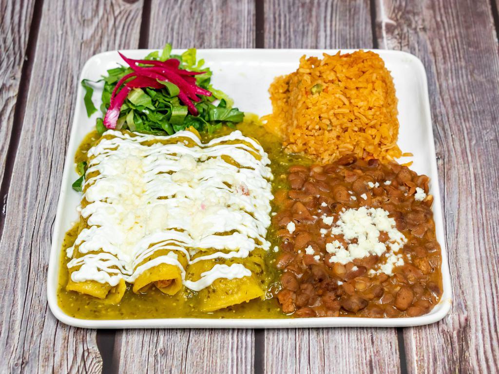 Chicken Enchiladas  · Mole chocolate sauce (contains nuts) or verde sauce, rice, beans, sour cream, cheese.