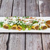 Taquitos Dorados  · Fried and rolled corn tortillas with 3 chicken and 3 potatoes, lettuce, sour cream, queso fr...