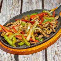 Sizzling Fajitas · Choice of, steak, chicken, or shrimp. Comes with bell pepper, onions, rice, beans, side of f...