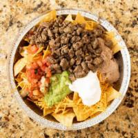 Super Nachos · Your choice of meat, guac, pico, sour cream, beans, and cheese.
