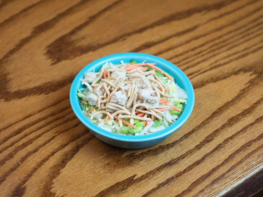 Asian Chicken Salad · Shredded napa cabbage, carrots, green onions and edamame tossed with sweet soy dressing and topped with chow mein noodles and Asian garlic antibiotic-free chicken.