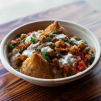 Samosa Chat Bowl · A famous Indian street food that starts with 2 Veg Samosa's (fried pastry with seasoned pota...