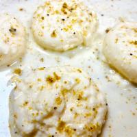 Rasmalai · Sweet and soft paneer cheese patties, soaked in a sweet creamed milk sauce