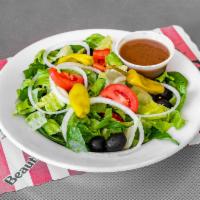 House Salad · Romaine lettuce, spinach, tomatoes, pepperoncini peppers, onions, and olives.