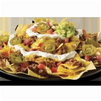 Big Freak’n  Nachos Beef  · The Big Freak’n Nachos are for when your eyes are bigger than your stomach, loads of queso, ...