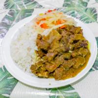 Curried Goat · Served with steamed vegetables and one choice of side.