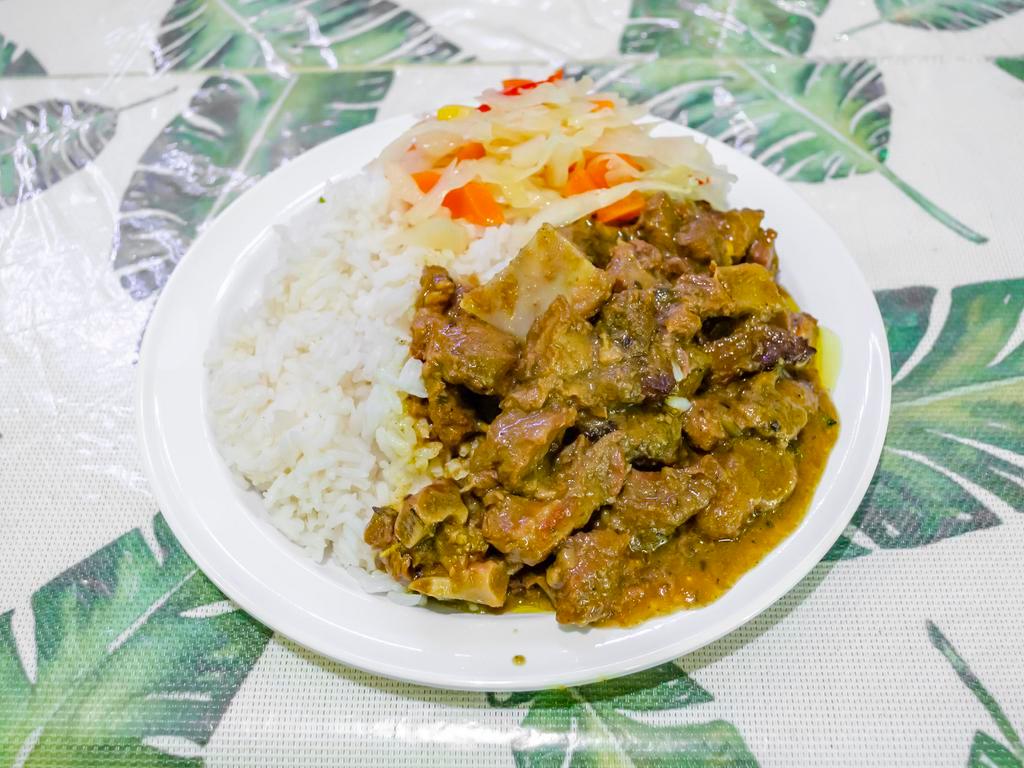Curried Goat · Served with steamed vegetables and one choice of side.