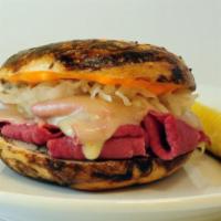The Reuben · Hot corned beef or roasted turkey, melted Swiss cheese, sauerkraut and Russian dressing.