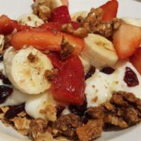 Yogurt Parfait  · House-made cranberry granola, vanilla yogurt, seasonal fruit, walnuts, and honey. Vegetarian.