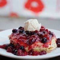 Berry Berry Pancakes · 3 lemon-oatmeal pancakes topped with macerated mixed berries and whipped mascarpone cream. V...