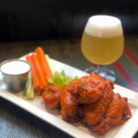 Bakers Dozen Wings · Baker's dozen with choice of buffalo or sweet chili. Served with carrots, celery, and blue c...