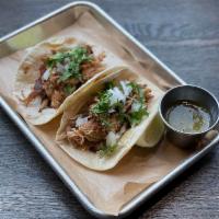 Pulled Pork · Roasted pork, white onions, cilantro, and salsa verde.