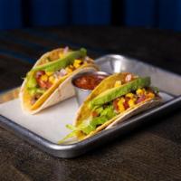 Vegan Double Decker Tacos · Crunchy corn shell, flour tortilla, vegan cheddar, plant-based meat, refried beans, avocado,...
