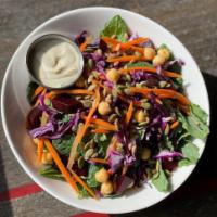 Super Bowl · Kale, farro, chickpeas, pumpkin seeds, red beets, shredded carrots, and red cabbage in a map...