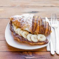 Banana Nutella Croissants · Croissant filled with Nutella and fresh bananas. drizzled with Nutella on top.