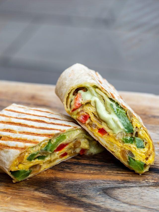 Egg Wrap · Thin flour tortilla stuffed with 2 scrambled eggs, sauteed onions, peppers and avocado sauce. 