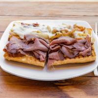 Roast Beef Sandwich · Roast beef slices topped with mozzarella and sauteed onions served with horseradish mustard ...