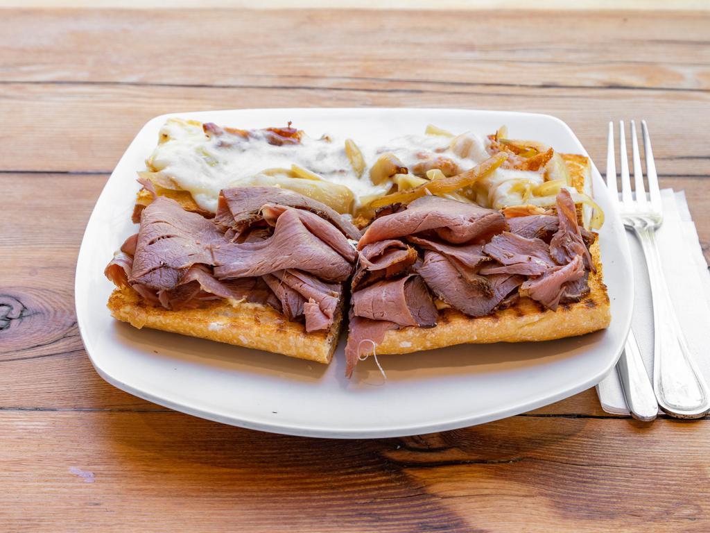 Roast Beef Sandwich · Roast beef slices topped with mozzarella and sauteed onions served with horseradish mustard dressing.