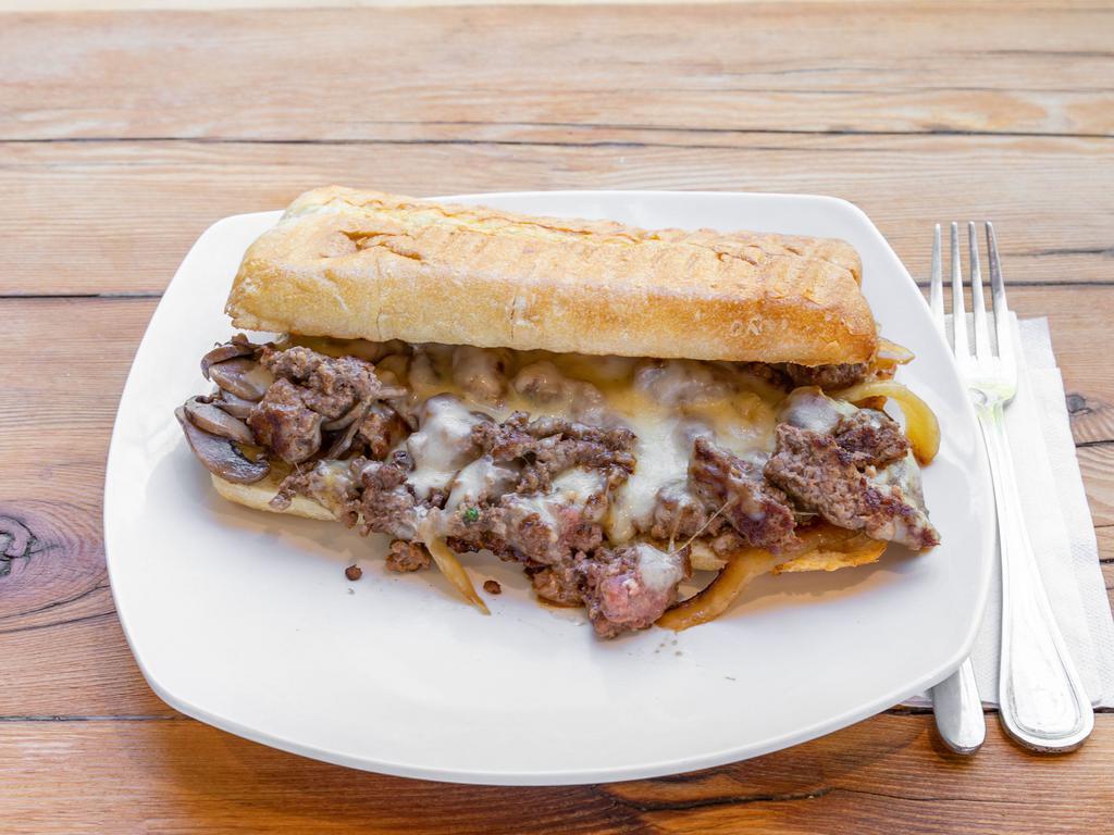 Chopped Meat Sandwich · Grounded grass fed angus beef blended with sauteed mushrooms, sauteed onions, mozzarella and provolone cheese.