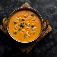 Kaju Curry · Tangy cashew curry made with tomato onion gravy 