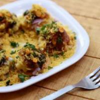  Sev Puri  · Sweet, spicy and tangy combination of papdi, boiled potatoes, onions and chutney topped with...