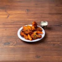 Wings · Crispy chicken wings served with celery, carrots and house made blue cheese dressing.