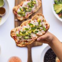 Tres Colores Pizza · Fresh marinara, vegan mozzarella, peppers, onions, corn, and spinach with pesto de cilantro ...