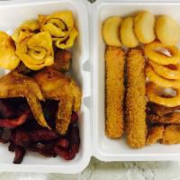 24. Pu Pu Platter · Serves 2. ( 2 wings,4 fried wonton,4 onion rings,4 fried baby shrimps,4 fried scallops, a li...
