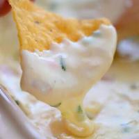 Chips & White Cheddar Queso · Served with our homemade roasted salsa.