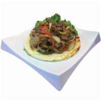 Arepa con Salteado · Corn cake topped with beef or chicken sauteed with onions and peppers.. 