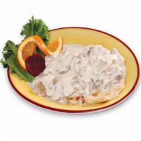 Pechuga en Crema de Champiñones  · Grilled chicken breast in mushrooms cream. It comes with salad, rice, beans or French fries.