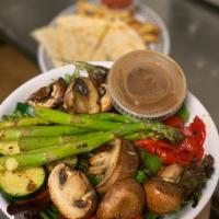 Grilled Veggie Salad · Mixed greens with grilled veggies including mushrooms, roasted red peppers, asparagus and zu...