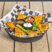  Tequila Butter Quesadilla · Tortillas brushed with our house-made tequila butter and filled with cheddar-jack, and pobla...