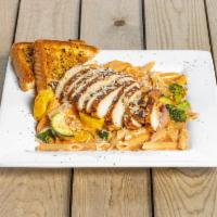 Vodka Pasta · Penne pasta mixed up with our sauteed veggies and drowned in our house-made creamy vodka sau...