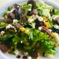 Harvest Salad · mesclun greens, roasted butternut squash, crumbled goat cheese, glazed pecans, cranberry vin...
