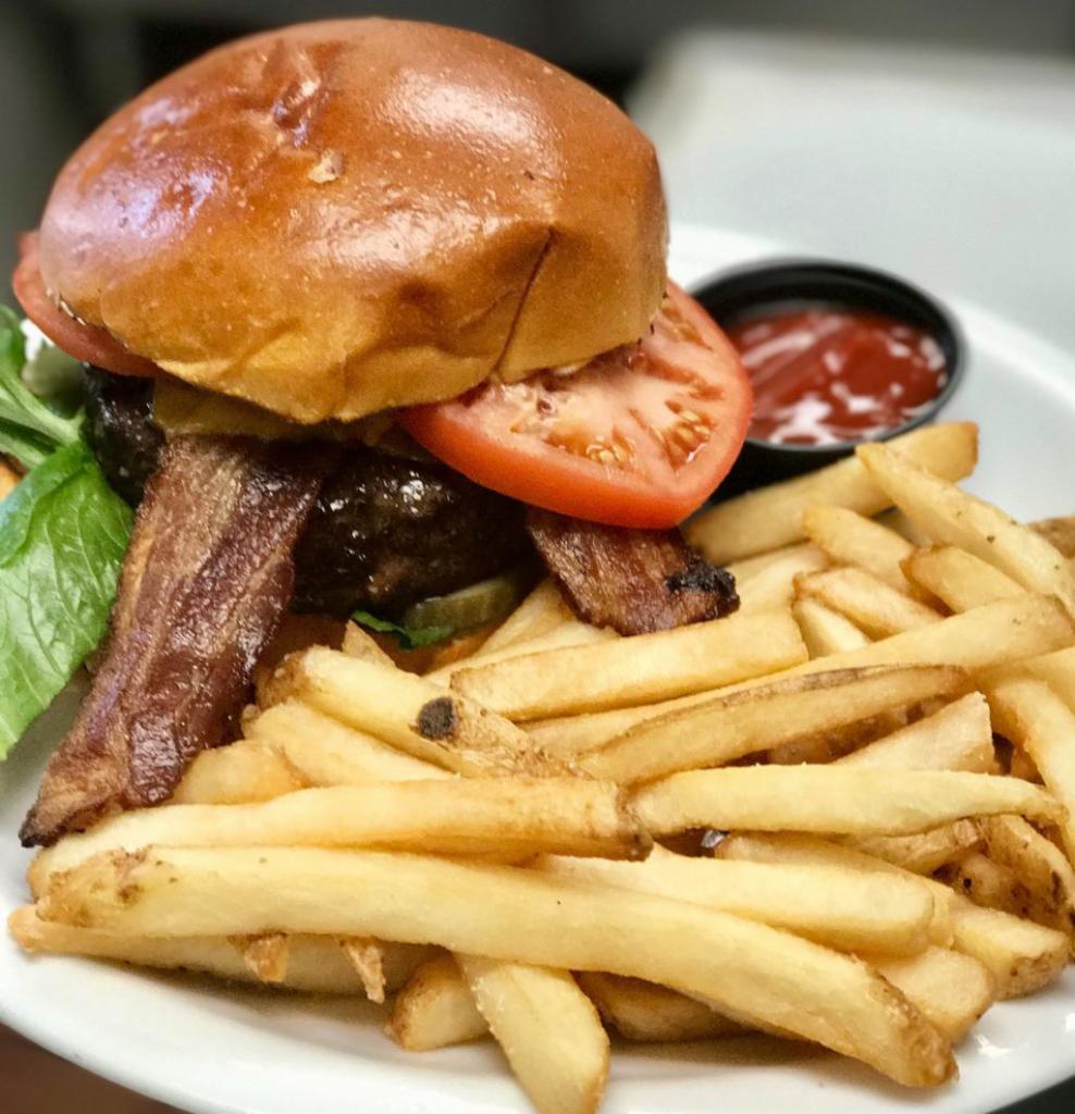 Black Angus Bacon Cheeseburger · thick-cut bacon, cheddar, homemade 
pickles, lettuce, tomato, catchy. sauce, brioche roll, french fries