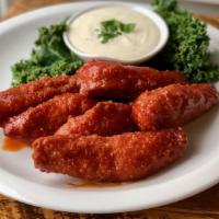 Kid's Buffalo Chicken Fingers with Fries · Panko-crusted white meat chicken, twangy Buffalo sauce, homemade ranch dressing and french f...