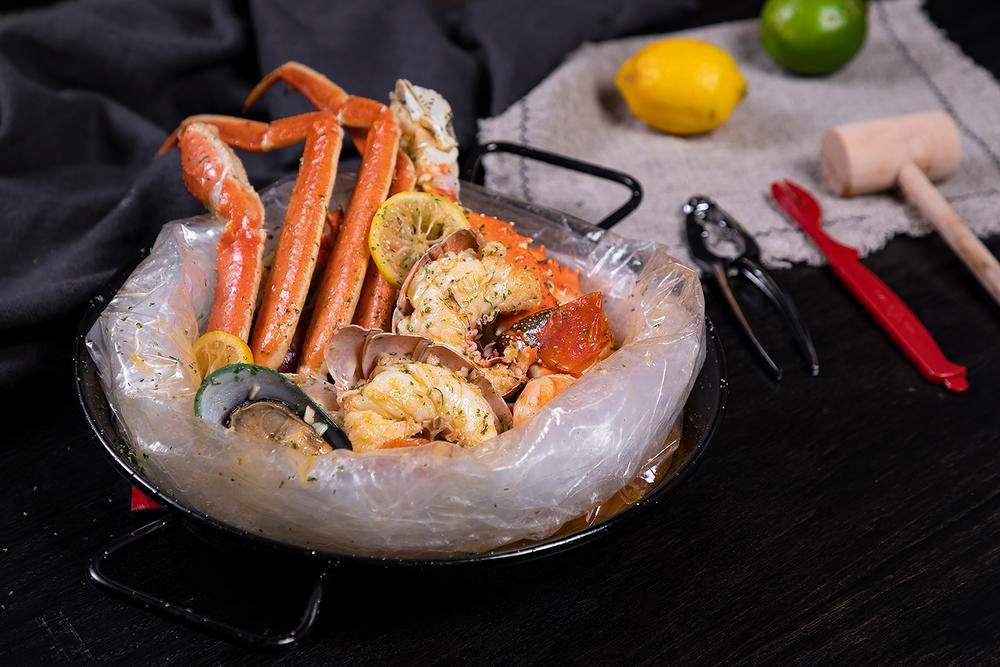 Combo Special A · Served with 1 corn and 2 potatoes. 1/2 lb. black mussel, 1/2 lb. shrimp, and 1/2 lb. snow crab.