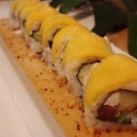 Golden Flower Roll · Shrimp avocado and eel inside and mango on the top. 