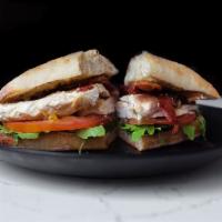 Grilled Chicken Sandwich · Tomato, arugula, avocado, mozzarella and chipotle mayo. On ciabatta with your choice of side