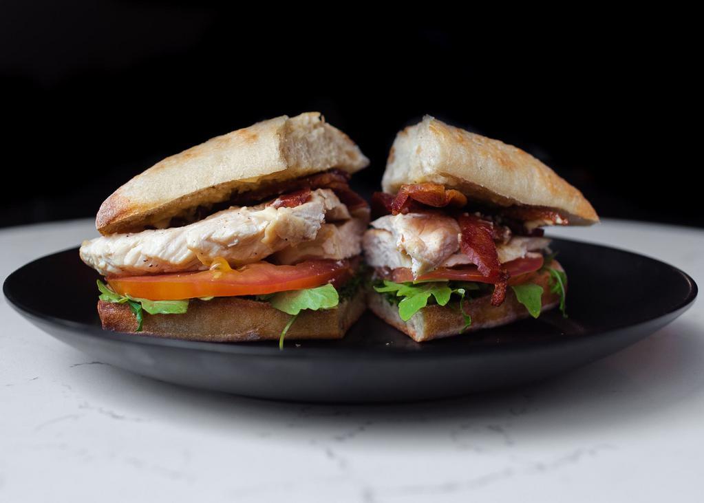 Grilled Chicken Sandwich · Tomato, arugula, avocado, mozzarella and chipotle mayo. On ciabatta with your choice of side